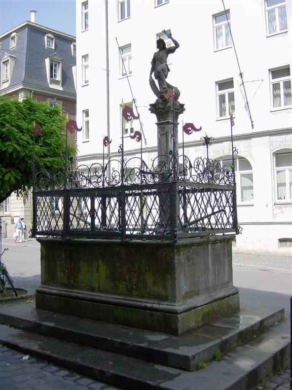 public-fountain-arms-on-side-pivot-to-pour-out-collected-water