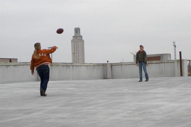 Melanie and Hagen toss a football - pregame tailgate