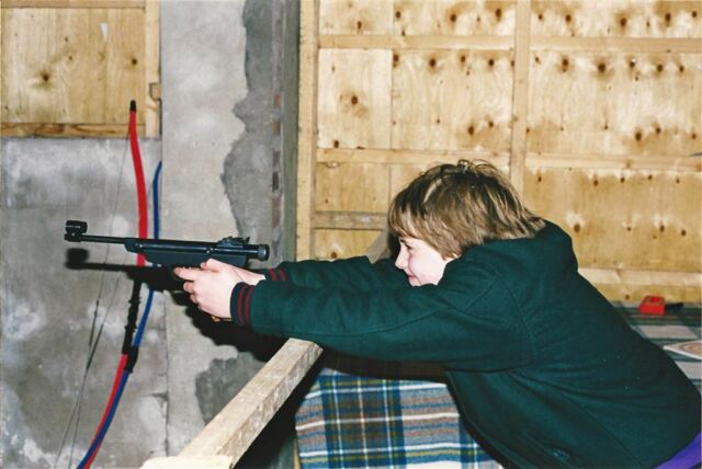 Mark shoots the air pistol