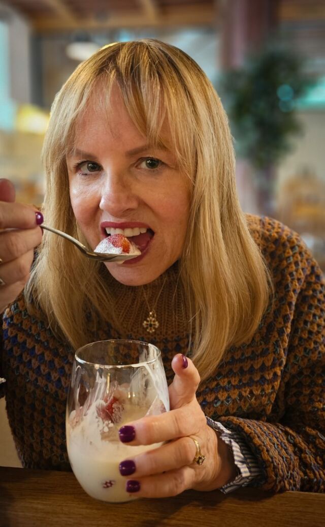 Kathy enjoying some strawberries and cream