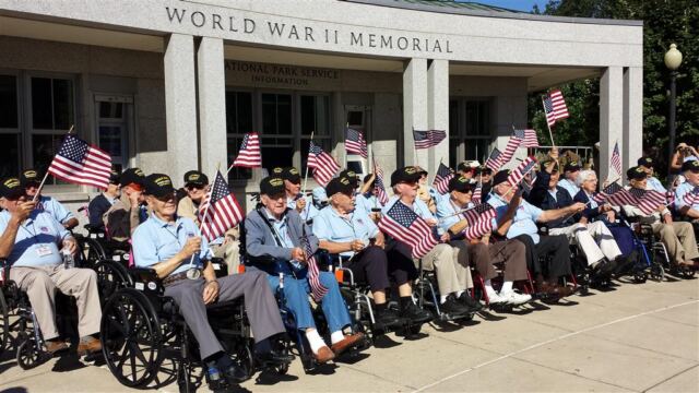 waving flags at the wwii memorial entrance