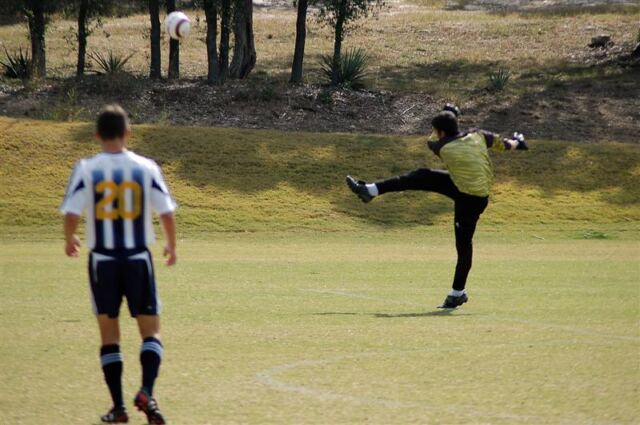 andrew-punts-the-ball-clear