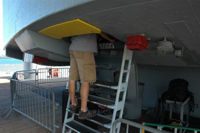 Andrew climbing into aft turret