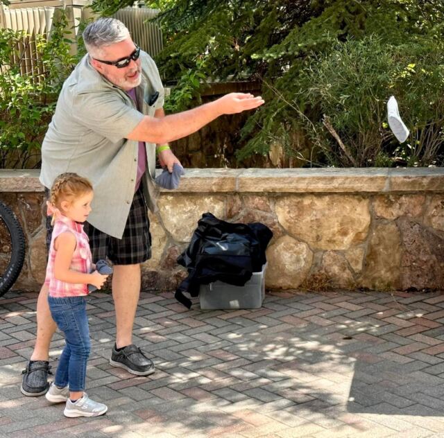 Grandpa shows Shiloh how to toss a beanbag