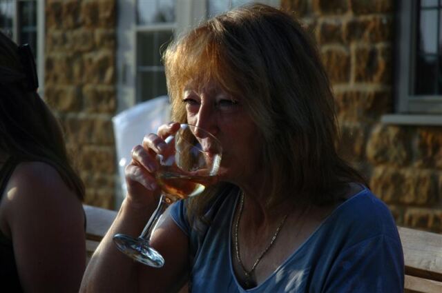 Marianne sips her wine