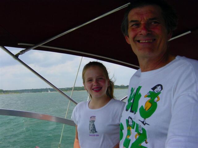 melanie-and-gene-driving-the-boat