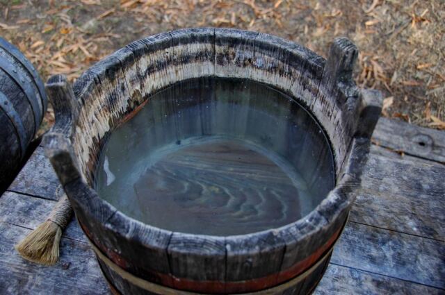 The water is frozen in the bucket