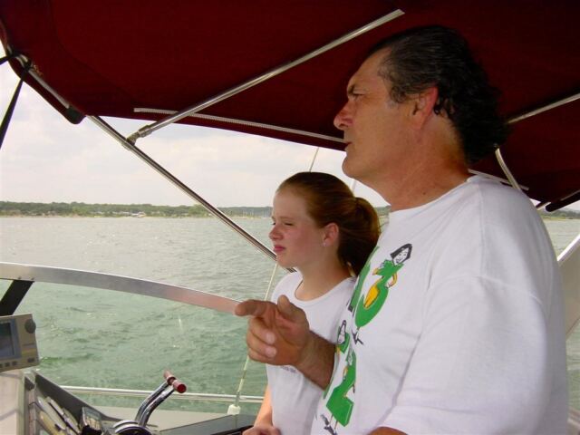 gene-teaches-melanie-how-to-drive-the-boat