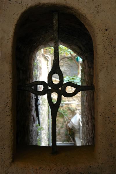 Iron grating on old window