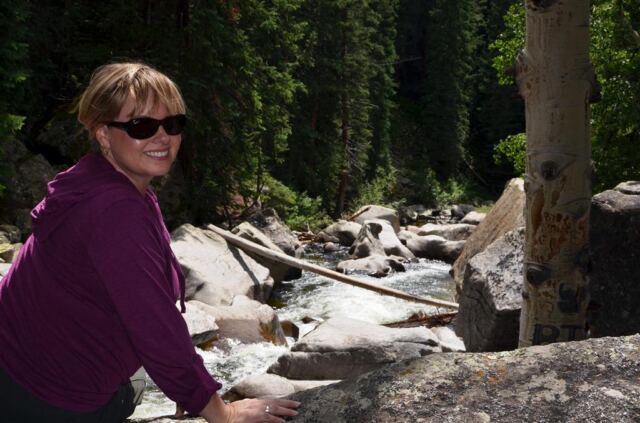 Kathy overlooks a rushing stream