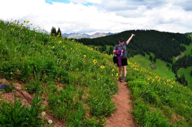 Kathy walks through the wildflowers
