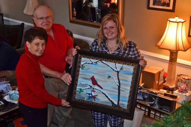 Geri-Paul-and-Melanie-with-her-gift-to-them