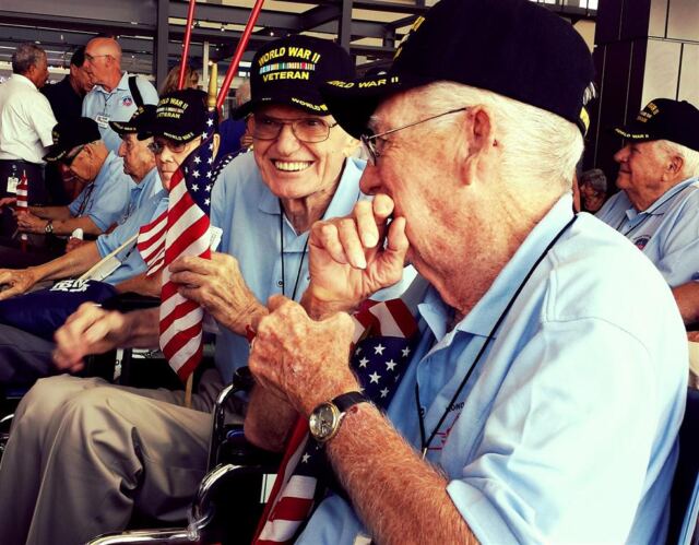 sharing a humorous moment with another wwii vet