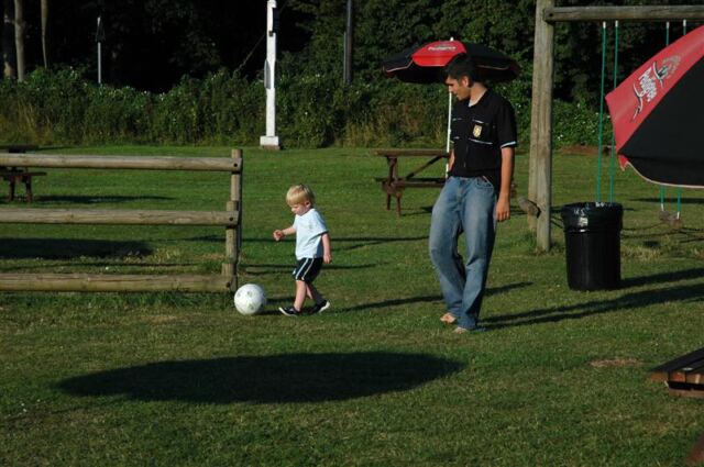 Sam dribbles with Andrew