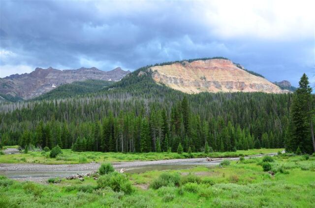 Cliffslide and approaching storm clouds
