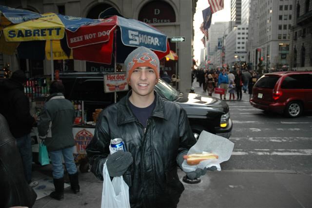 Andrew gets a Sabrett's hot dog from a street vendor