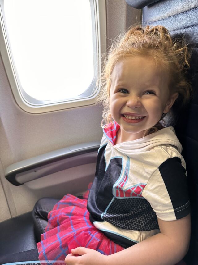 Someone's excited to take her first airplane flight