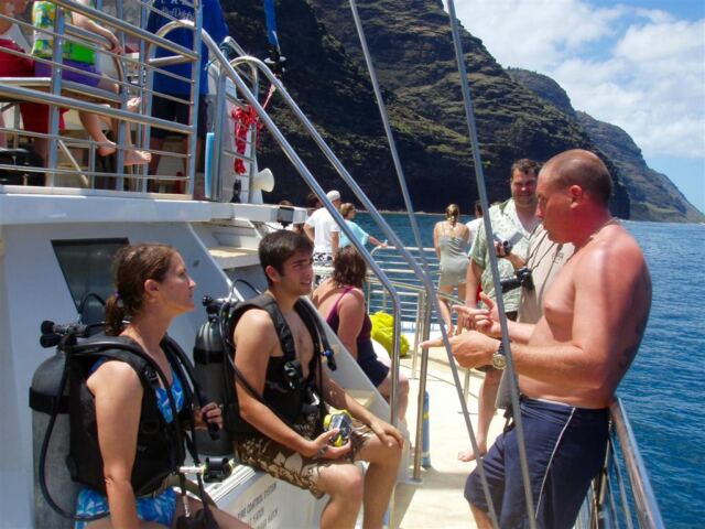 PO - Patti and Andrew listen to the divemaster