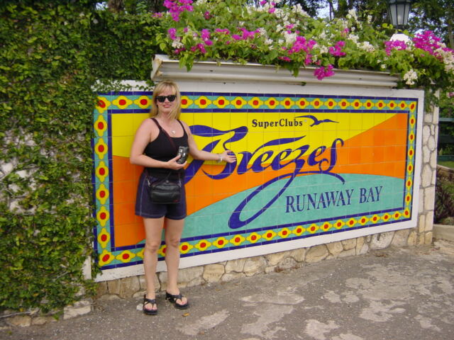 Kathy at the Breezes sign