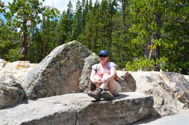 Kathy on a rock bench at Inspiration Point