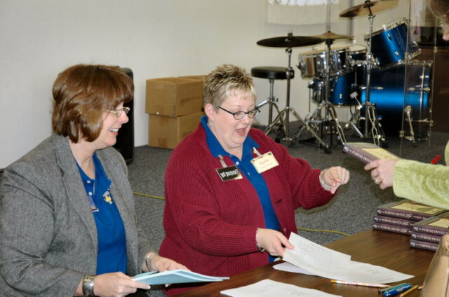 JoAnn and Katie hand out materials