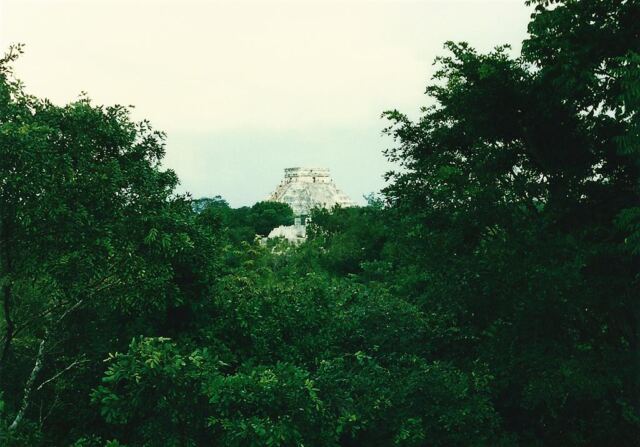 El Castillo rises above the jungle in the distance, as seen from El Caracol