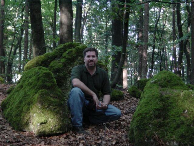 roger-crouches-by-the-moss