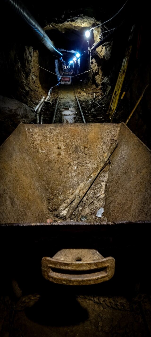 Mine cart and cave-in in the distance
