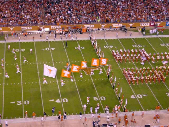 Flags lead the Horns out