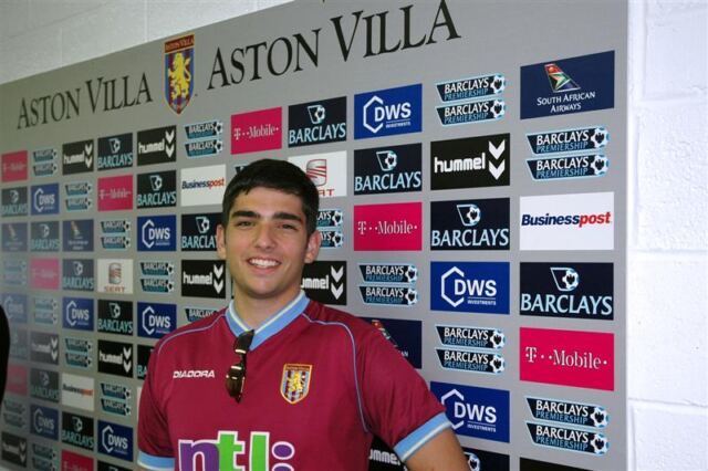 Andrew in front of Villa interview board