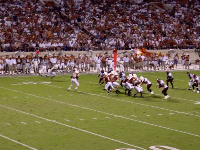 Simms drops back to pass