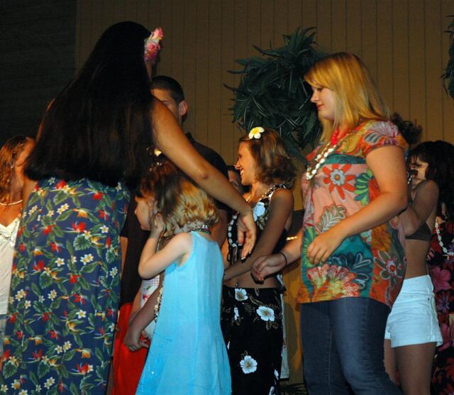 Kiersten and Melanie volunteer for hula demo