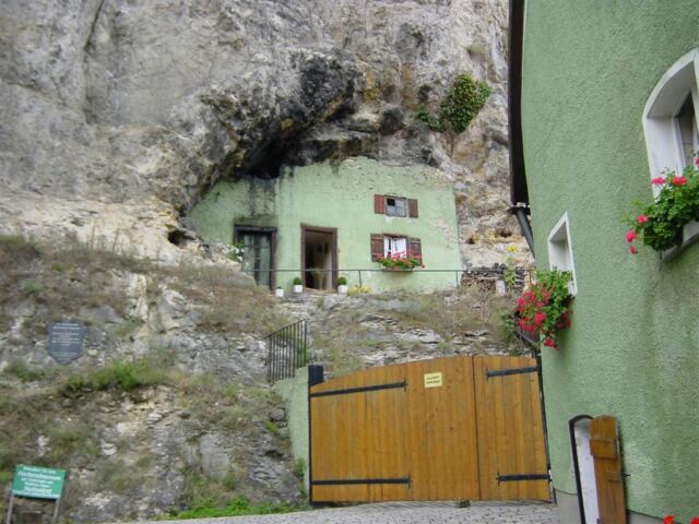 house-built-into-side-of-cliff