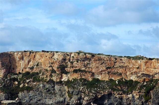 Large gun on top of cliff