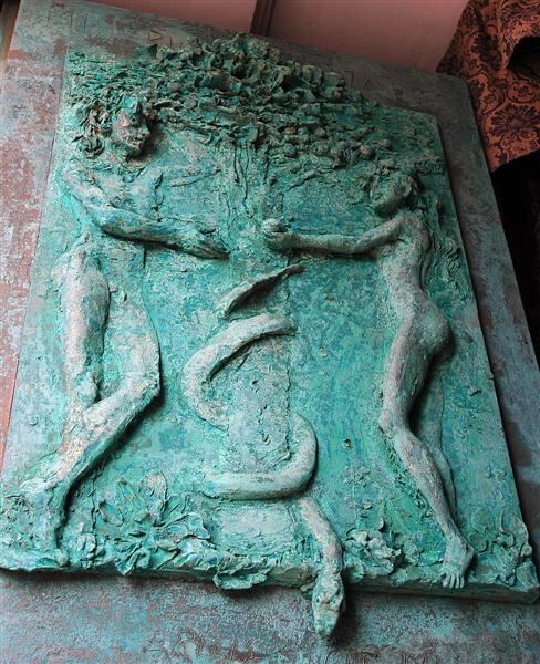 Adam and Eve carved into the stone
