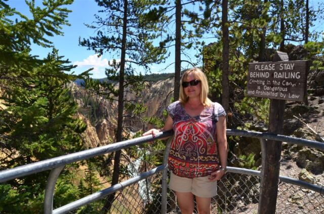Kathy stays behind the railing