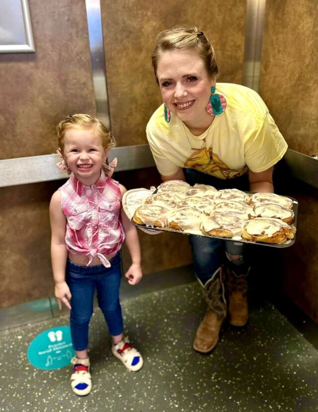 Shiloh and Mommy taking the sweetrolls for breakfast