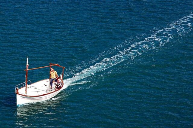 Small boat passes alongside