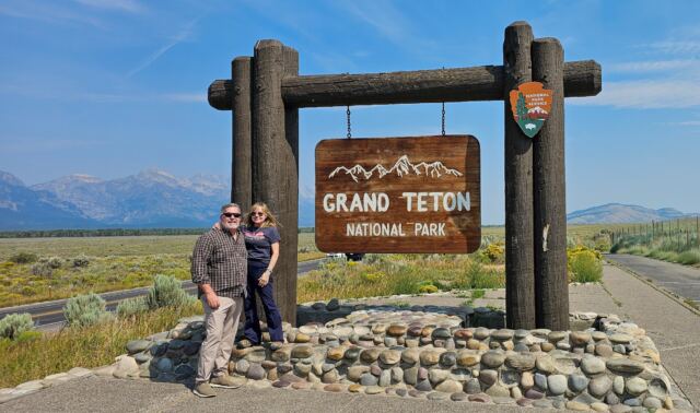 Roger-Kathy at GTNP sign