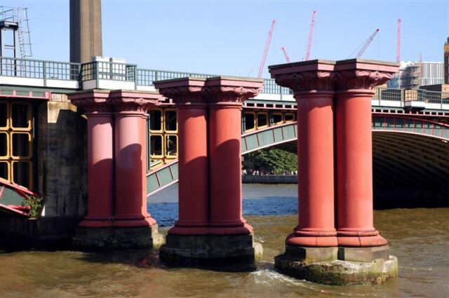 Old bridge supports over the Thames river