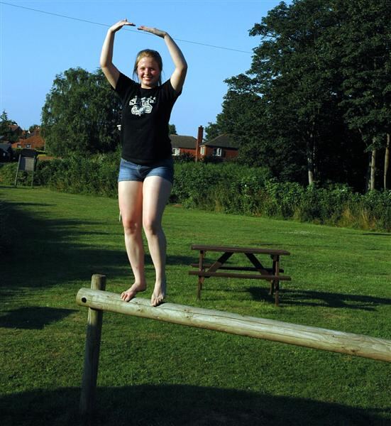 Melanie poses on the beam