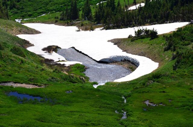 Snow surrounds the lake