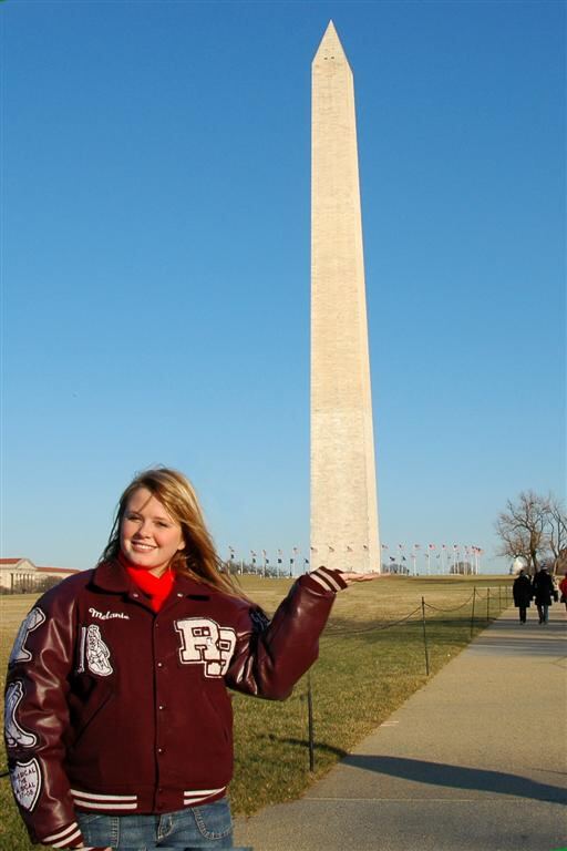 Mel holds a monument