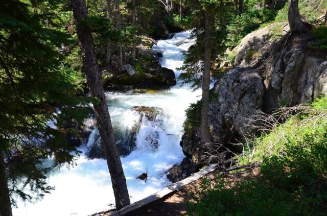 The trail leads upstream