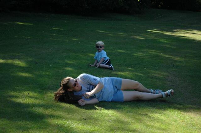 Jenny and Sam roll down the hill