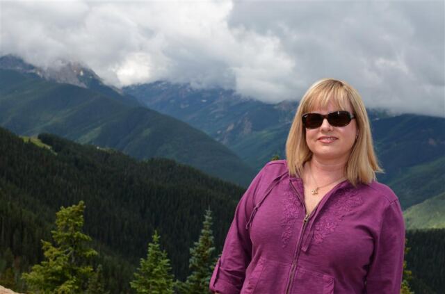 Kathy atop the cloudy mountain