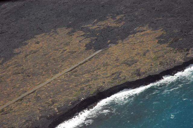 Coastline road cut off by lava flow