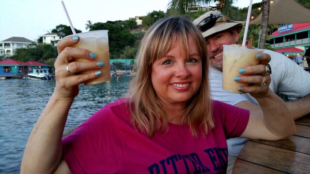 Kathy double-fisting Painkillers while Chris photobombs