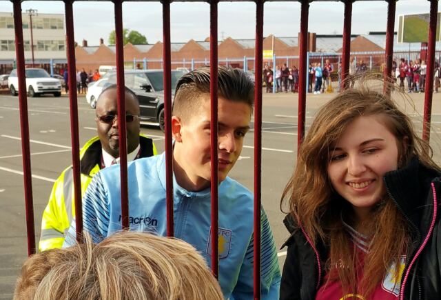 Jack Grealish taking pictures with fans