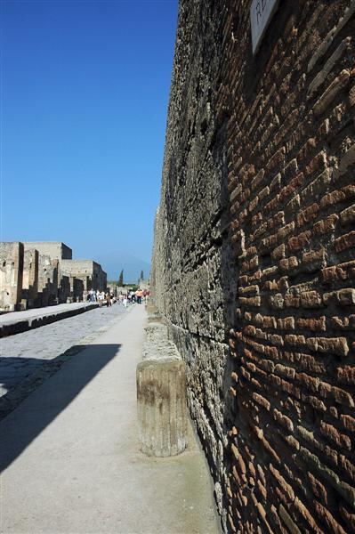Pompeii walls with Vesuvius in the distance